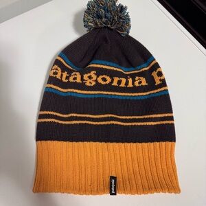 Patagonia knit pom beanie in black, mustard & teal